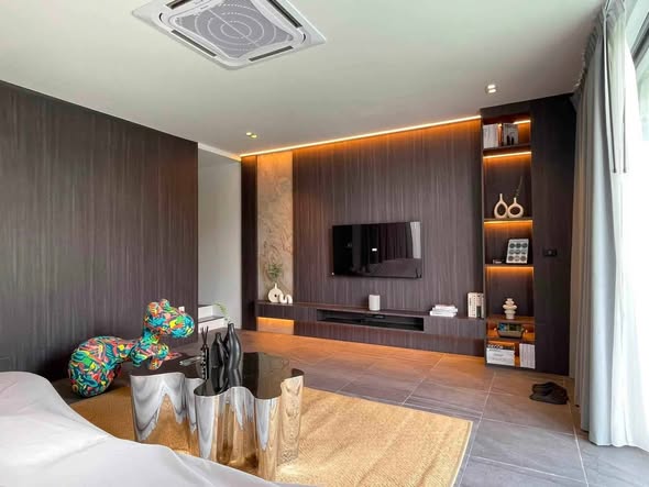 bedroom and living room of พูลวิลล่ากรุงเทพ แบริ่ง A