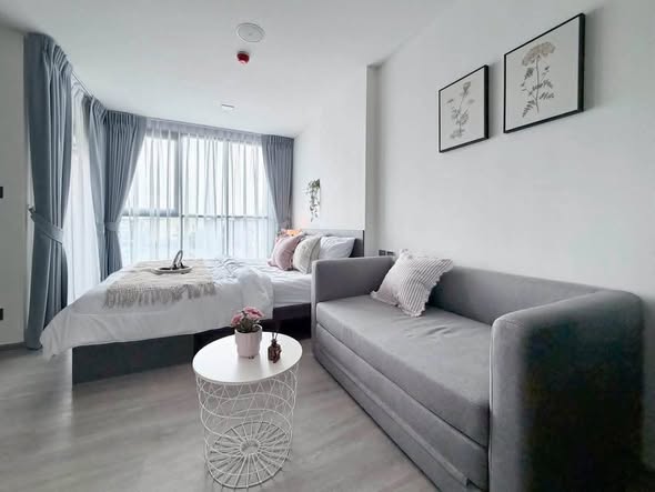 bedroom and living room of Atmoz Palacio Ladprao Wanghin | แอทโมซ พาลาซิโอ ลาดพร้าว วังหิน