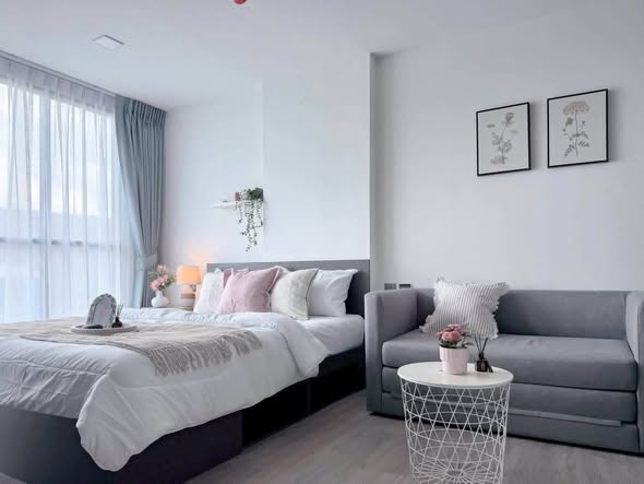 bedroom and living room of Atmoz Palacio Ladprao Wanghin | แอทโมซ พาลาซิโอ ลาดพร้าว วังหิน