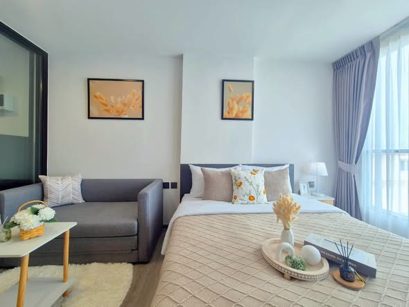 living room and bedroom of Atmoz Palacio Ladprao Wanghin | แอทโมซ พาลาซิโอ ลาดพร้าว วังหิน