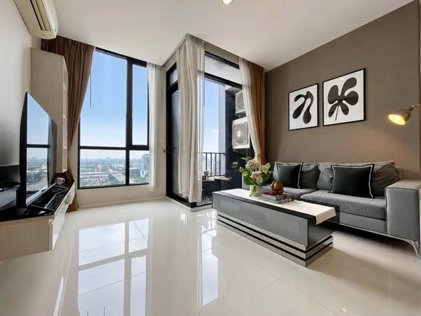 bedroom and living room of อัพเอกมัยคอนโดมิเนียม