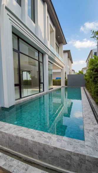 pool and room interior of BELGRAVIA Exclusive Pool Villa Bangna – Rama9
