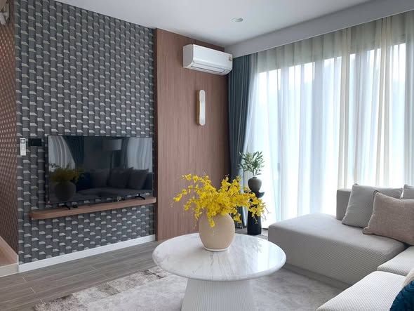 living room and bathroom of Burasiri Krungthep Kreetha