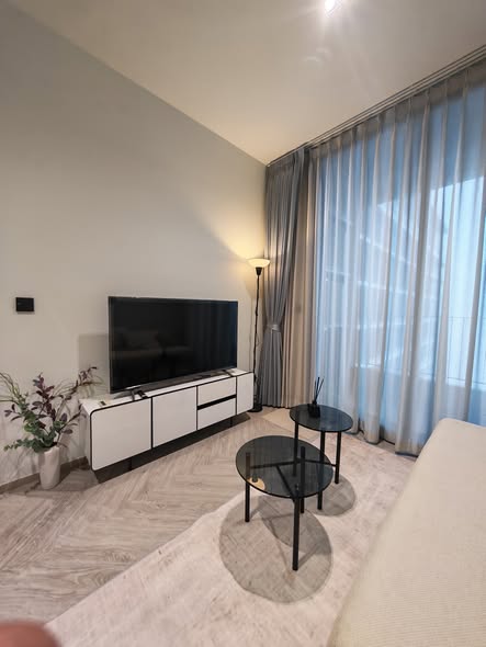 living room and bedroom of Chapter Charoennakhon–Riverside