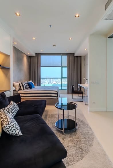 living room and bedroom of Chatrium Hotel Riverside Bangkok