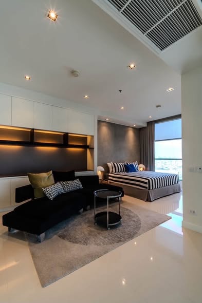 living room and bedroom of Chatrium Hotel Riverside Bangkok