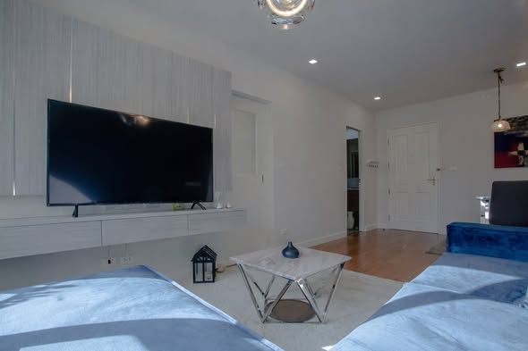 bedroom and living room of Condo One X