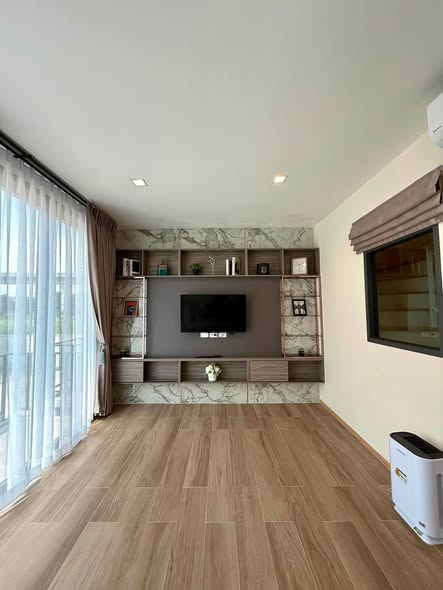 living room and bedroom of Eigen Premium Townhome