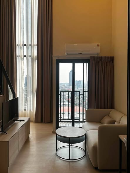 living room and bedroom of FLO by Sansiri