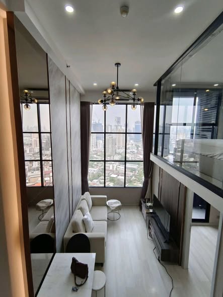 living room and bathroom of KnightsBridge Prime Sathon