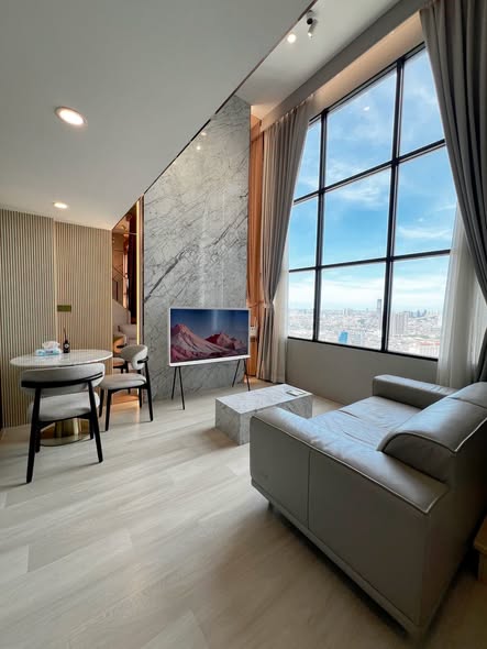 living room and bedroom of KnightsBridge Prime Sathon