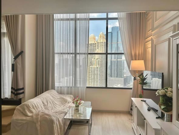 living room and bedroom of KnightsBridge Prime Sathon