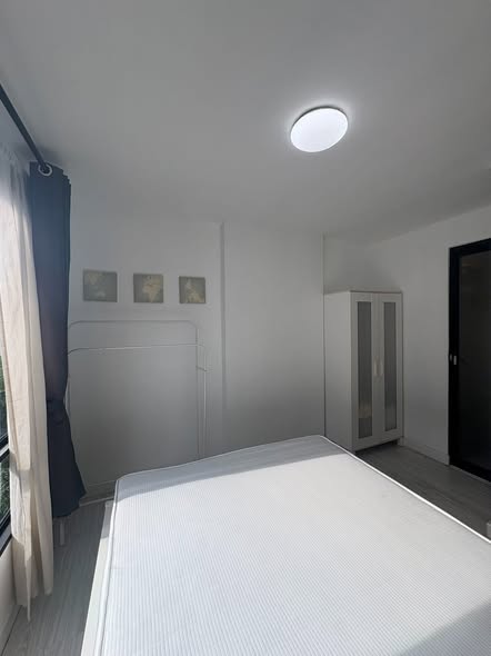 bedroom of L Style Condo