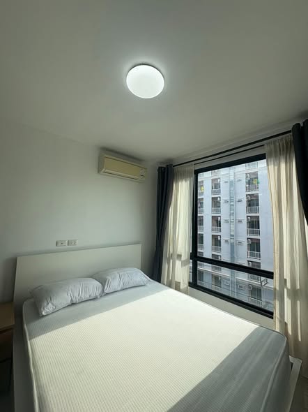 bedroom of L Style Condo