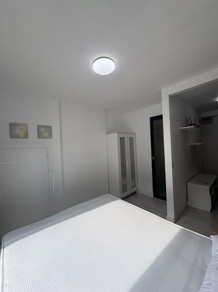 bedroom of L Style Condo