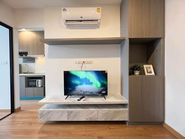 living room and kitchen of Magnix Condo Ramintra21