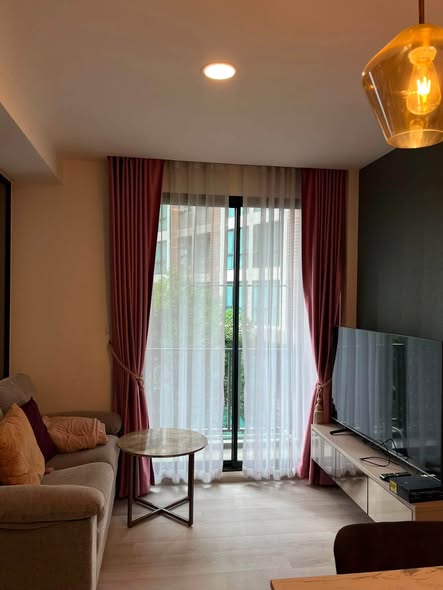 bedroom and living room of Maxxi Prime Sutthisan Condo