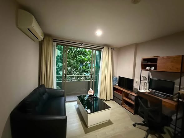 living room and bedroom of Metro Luxe Ratchada