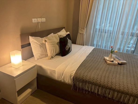 bedroom of Metro Luxe Riverfront Rattanathibet