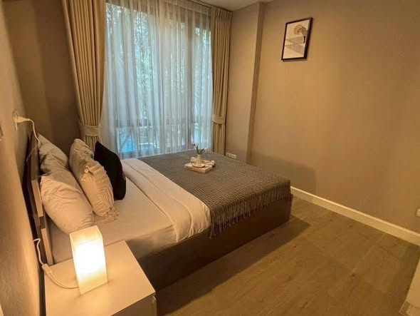 bedroom of Metro Luxe Riverfront Rattanathibet