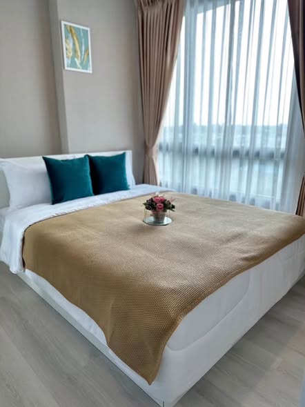 bedroom of Metro Luxe Riverfront Rattanathibet
