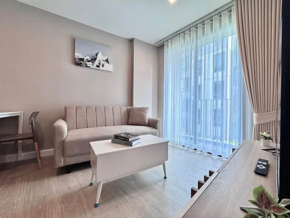 bedroom and living room of Metro Luxe Riverfront Rattanathibet