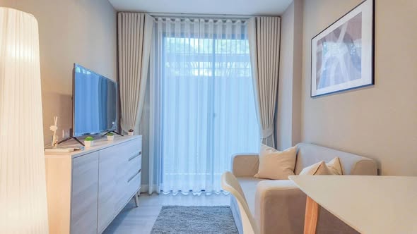 living room and bedroom of Metro Luxe Riverfront Rattanathibet