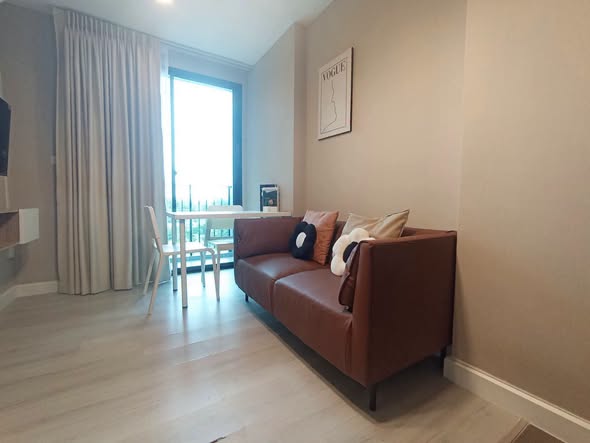 living room and bedroom of Metro Luxe Riverfront Rattanathibet