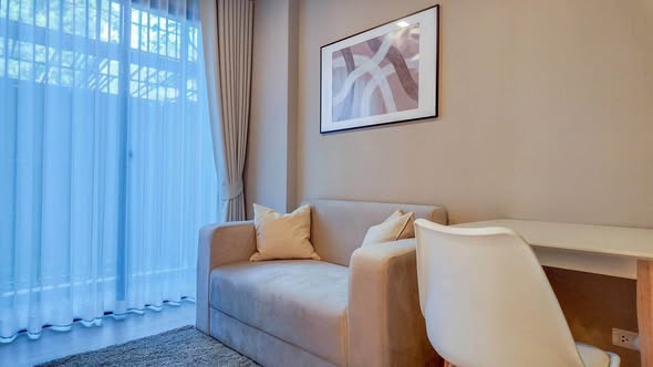 living room and bedroom of Metro Luxe Riverfront Rattanathibet
