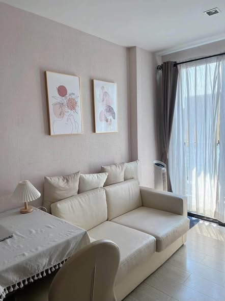 living room and bedroom of Metro Luxe Riverfront Rattanathibet