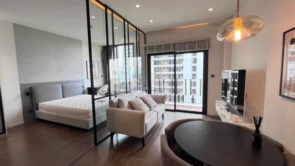 living room and bedroom of MUNIQ Sukhumvit 23