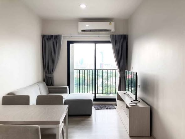bedroom and living room of นิช โมโน เมกะ สเปซ บางนา (Niche MONO Mega Space Bang Na)