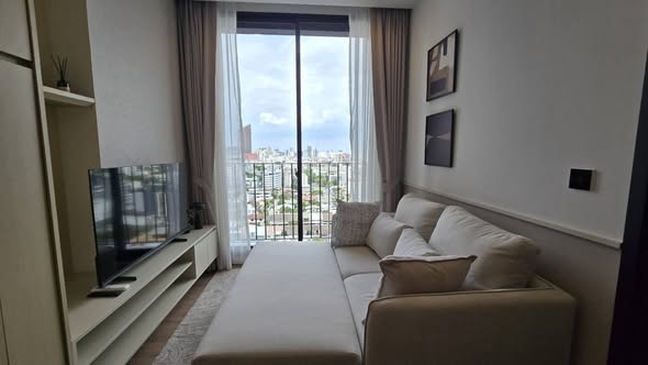 bedroom and living room of Noble Around Ari