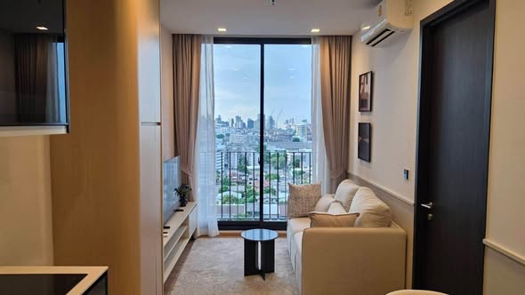 bedroom and living room of Noble Around Ari
