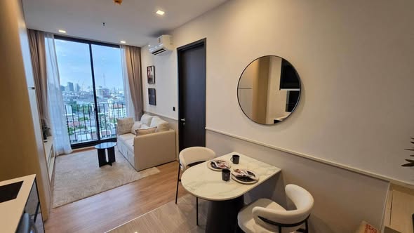 living room and bedroom of Noble Around Ari