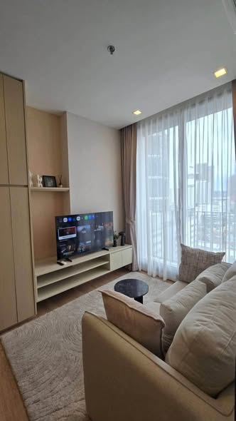 living room and bedroom of Noble Around Ari