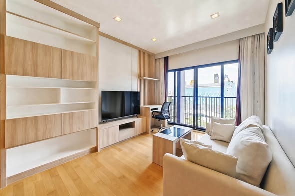 bedroom and living room of Noble Reveal