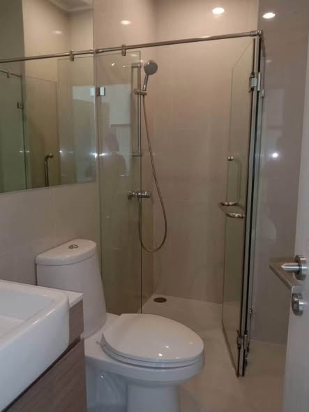 room interior and bathroom of Noble Revolve Ratchada 1