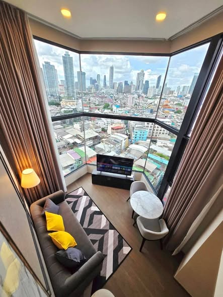 living room and bedroom of Park Origin Chula-Sam Yan