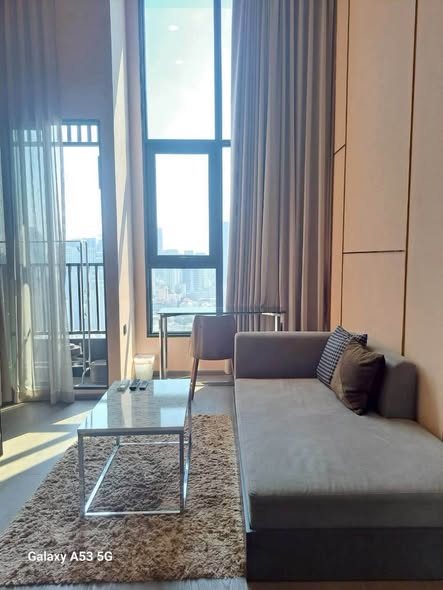 living room and bedroom of Park Origin Chula-Sam Yan