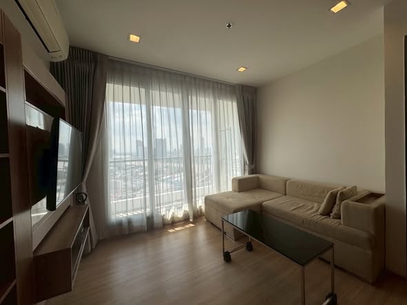 bedroom and living room of RHYTHM Sathorn