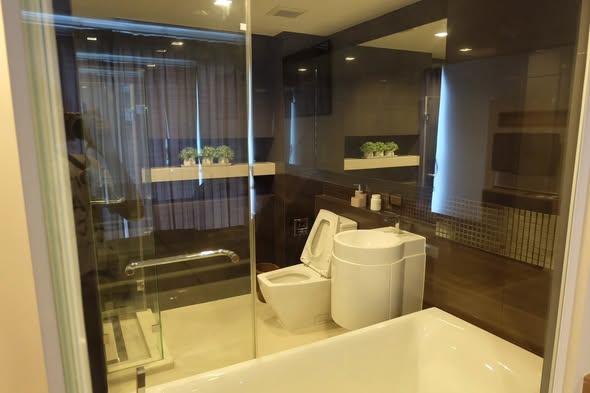 room interior and bathroom of RHYTHM Sathorn