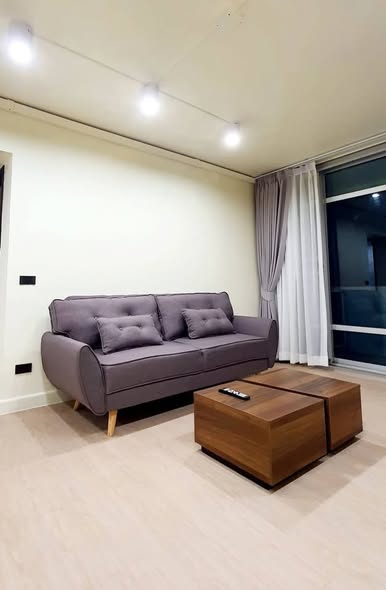bedroom and living room of Riviera Condominium