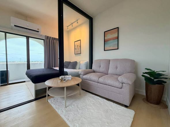bedroom and living room of Sereno Airport Condo