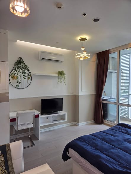 bedroom and living room of TC-Green Condominium