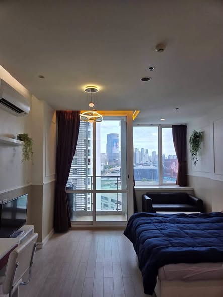 living room and bedroom of TC-Green Condominium