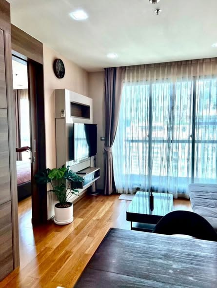 living room and bedroom of The Address Sathorn