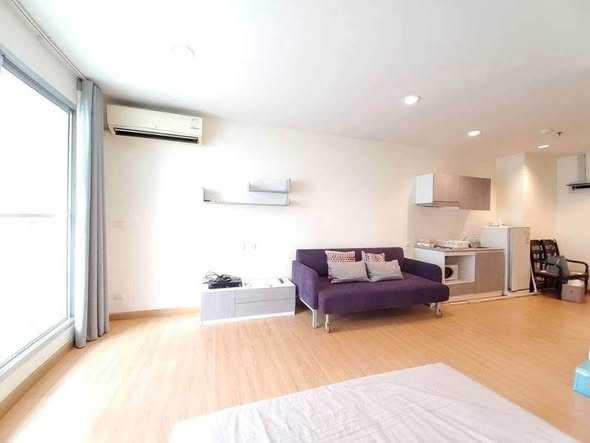 living room and bedroom of The Address Siam