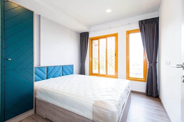 bedroom and room interior of THE BASE Sukhumvit 50
