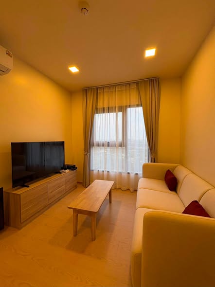 living room and bedroom of The Base Urban Rama9